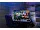 Game area with large TV and gaming console at 2641 Tranquility Way, Kissimmee, FL 34746