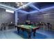 Game room with pool table, bar-height tables, and seating at 2641 Tranquility Way, Kissimmee, FL 34746