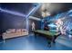 Fun game room with pool table, Star Wars mural, and comfortable seating at 2641 Tranquility Way, Kissimmee, FL 34746