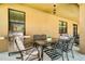 Outdoor patio with grill and dining furniture at 2641 Tranquility Way, Kissimmee, FL 34746