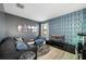 Home theater room with large TV and comfy seating at 2641 Tranquility Way, Kissimmee, FL 34746