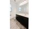 Clean bathroom with dark vanity, tile floor, and a toilet at 273 Ancona Ave, Debary, FL 32713