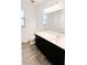 Bathroom with dark vanity, tile flooring and a sink at 273 Ancona Ave, Debary, FL 32713