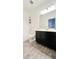Bathroom with dark vanity, tile flooring and a bathtub at 273 Ancona Ave, Debary, FL 32713