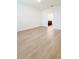 Bright bedroom with wood-look floors and access to bathroom at 273 Ancona Ave, Debary, FL 32713