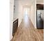 Hallway view of kitchen with dark cabinetry and stainless steel appliances at 273 Ancona Ave, Debary, FL 32713