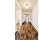 Long hallway with wood-look tile floors at 273 Ancona Ave, Debary, FL 32713