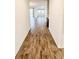 Hallway with wood-look tile floors, leading to living area at 273 Ancona Ave, Debary, FL 32713