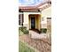 Front entry with brick columns and a modern door at 273 Ancona Ave, Debary, FL 32713
