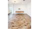 Living area with floating shelves and wood-look floors at 273 Ancona Ave, Debary, FL 32713