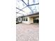 Large covered patio with paver stones and a screened enclosure at 273 Ancona Ave, Debary, FL 32713