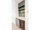 Modern wet bar with beverage cooler, stylish shelving, and dark cabinetry at 273 Ancona Ave, Debary, FL 32713