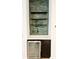 Stylish wet bar with green tile backsplash and floating shelves at 273 Ancona Ave, Debary, FL 32713