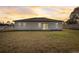 Spacious backyard with grassy lawn and home exterior view at 2831 Sw 166Th Ln, Ocala, FL 34473