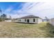 Large backyard with grassy area and single-story home at 2831 Sw 166Th Ln, Ocala, FL 34473