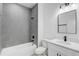 Bathroom with gray tile and white vanity at 2831 Sw 166Th Ln, Ocala, FL 34473