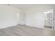 Spacious bedroom with wood-look floors and ensuite bathroom at 2831 Sw 166Th Ln, Ocala, FL 34473