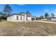 New construction home with gray garage door and grassy yard at 2831 Sw 166Th Ln, Ocala, FL 34473