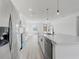 Modern kitchen with white cabinets and island at 2831 Sw 166Th Ln, Ocala, FL 34473