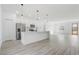 Modern kitchen features white cabinets, quartz countertops, and stainless steel appliances at 2831 Sw 166Th Ln, Ocala, FL 34473