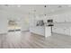 Open concept kitchen with white cabinets and island at 2831 Sw 166Th Ln, Ocala, FL 34473