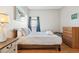 Bright bedroom featuring a queen-size bed and ample space at 305 Therese St, Davenport, FL 33897