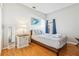 Cozy bedroom with wood flooring and a comfortable bed at 305 Therese St, Davenport, FL 33897