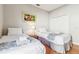 Bedroom with two twin beds, gray bedding, and a large closet at 305 Therese St, Davenport, FL 33897