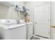 Convenient laundry room with washer, dryer, and shelving at 305 Therese St, Davenport, FL 33897