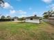 Large backyard with grassy area, shed, and fenced pool at 4030 Luray Dr, Orlando, FL 32812