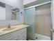 Updated bathroom with a walk-in shower and vanity at 4172 Versailles Dr # 4172D, Orlando, FL 32808