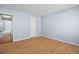 Spacious bedroom with wood-look floors and access to hallway at 4172 Versailles Dr # 4172D, Orlando, FL 32808