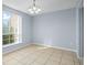 Bright dining area with tile floors and a window at 4172 Versailles Dr # 4172D, Orlando, FL 32808