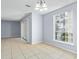 Dining room with tile floor, light walls and lake view at 4172 Versailles Dr # 4172D, Orlando, FL 32808