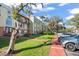 Two-story building with ample parking and landscaping at 4172 Versailles Dr # 4172D, Orlando, FL 32808