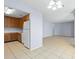 Kitchen with wood cabinets and white appliances at 4172 Versailles Dr # 4172D, Orlando, FL 32808