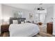 Main bedroom with a king-size bed, modern nightstands, and ceiling fan at 4403 Brooke St, Orlando, FL 32811