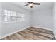 Simple bedroom with wood flooring and ceiling fan at 4403 Brooke St, Orlando, FL 32811