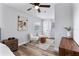 Bright bedroom with wood floors, ceiling fan, and access to exterior at 4403 Brooke St, Orlando, FL 32811