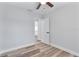 Simple bedroom with wood floors and ceiling fan at 4403 Brooke St, Orlando, FL 32811