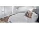 Main bedroom with plush bedding and wood-look floors at 4403 Brooke St, Orlando, FL 32811