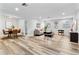 Open concept dining area with stylish table and chairs, adjacent to living room at 4403 Brooke St, Orlando, FL 32811
