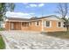 Updated single story home with new paint, landscaping, and a brick driveway at 4403 Brooke St, Orlando, FL 32811