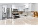 Renovated kitchen boasts stainless steel appliances and granite countertops at 4403 Brooke St, Orlando, FL 32811