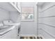 Bright laundry room, complete with washer, dryer, and shelving at 4403 Brooke St, Orlando, FL 32811
