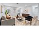 Light and airy living room with contemporary decor and hardwood floors at 4403 Brooke St, Orlando, FL 32811