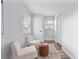 Cozy sitting area with two chairs and ottoman at 4403 Brooke St, Orlando, FL 32811