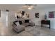 Open living area featuring a comfortable sectional sofa and stylish decor at 5437 Lake Margaret Dr # C, Orlando, FL 32812