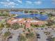 Aerial view of community clubhouse near lake at 672 Cordoba Dr, Davenport, FL 33837