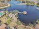 Aerial view of community lake, gazebo, and walking paths at 672 Cordoba Dr, Davenport, FL 33837